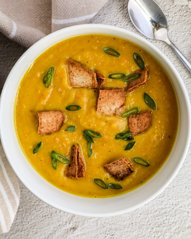 Shorbet Adas (Vegan Lentil Soup) in a bowl with pita croutons