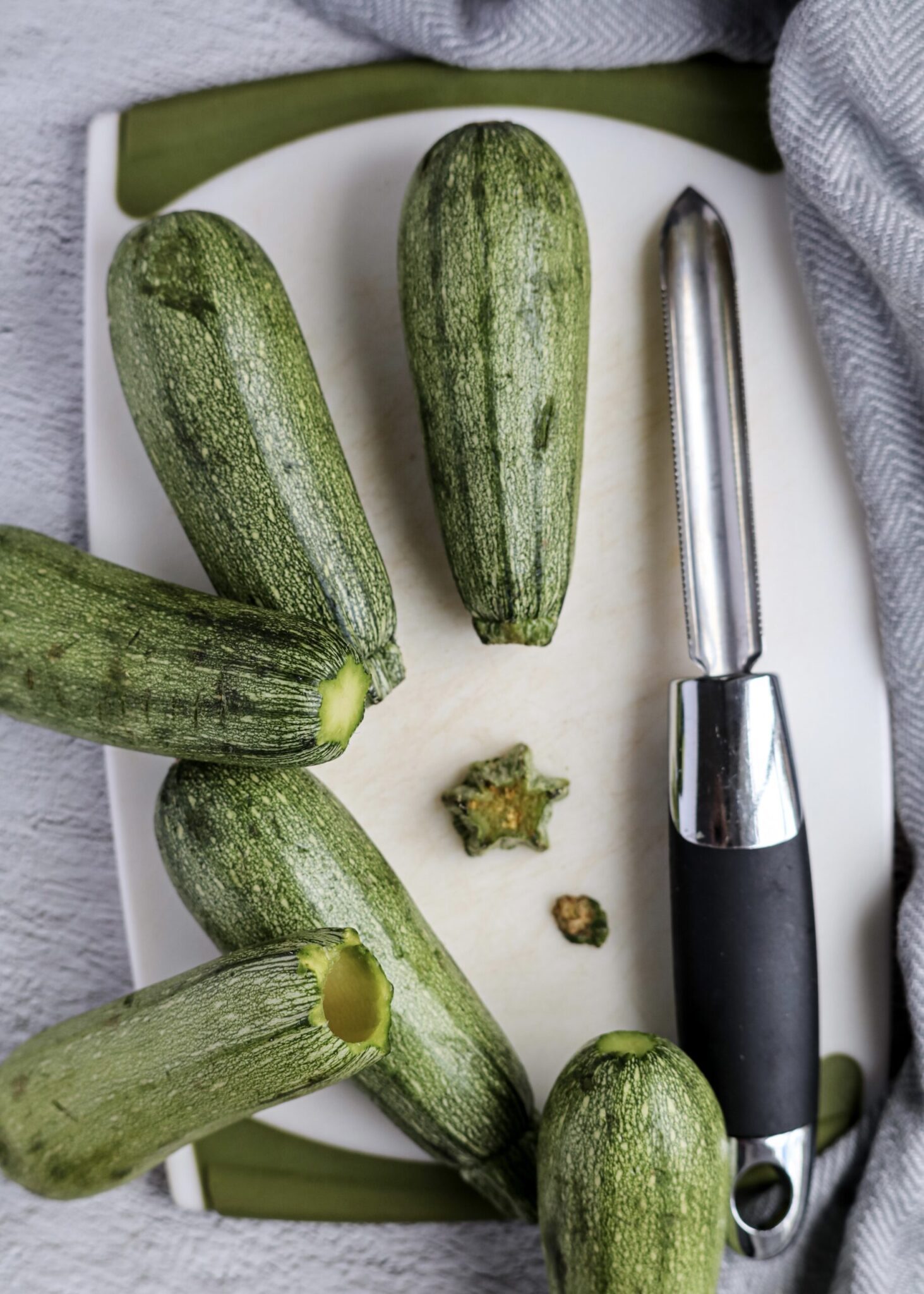 mini zucchini - flesh being removed with a vegetable peeler