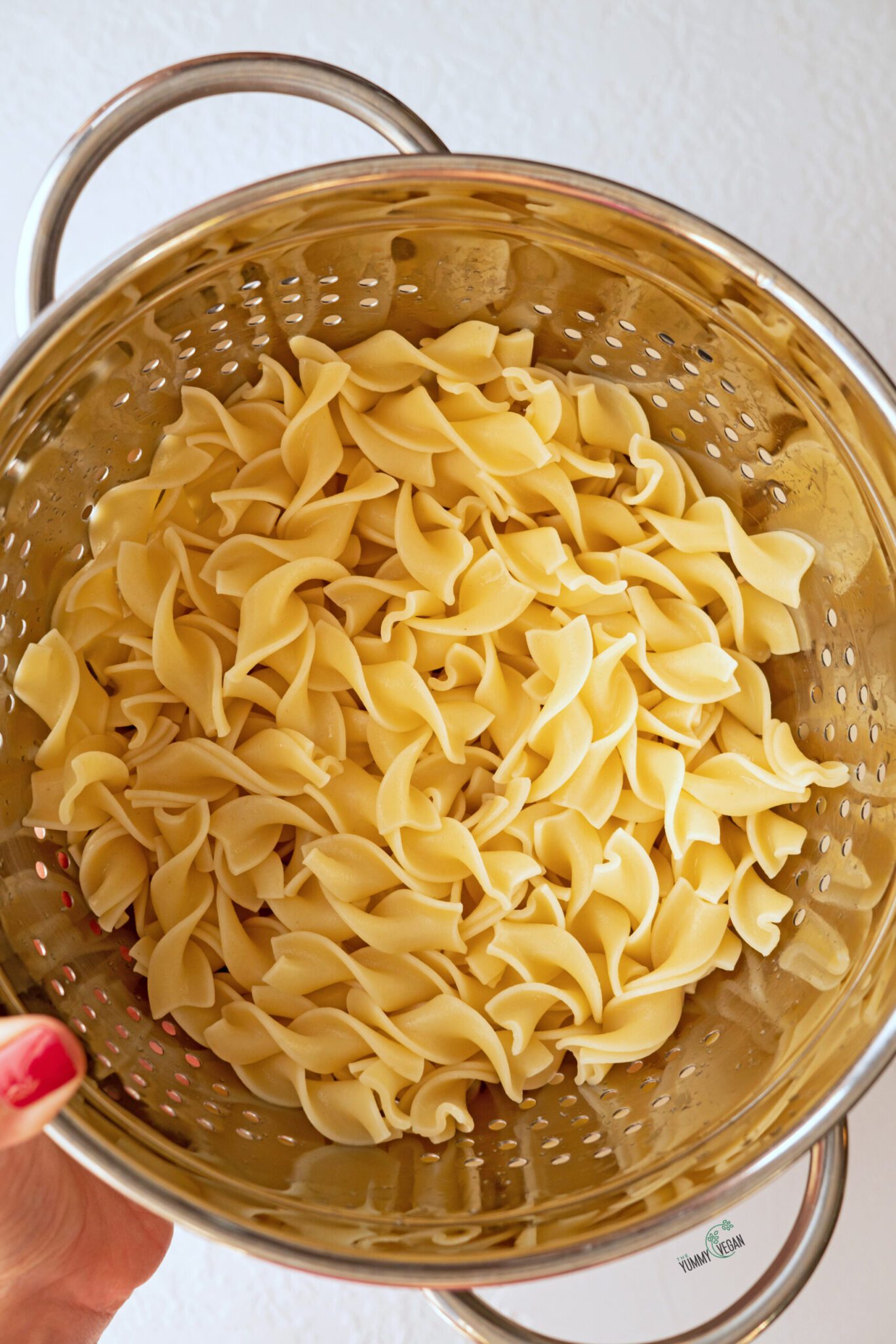 vegan chicken noodle soup - noodles being drained