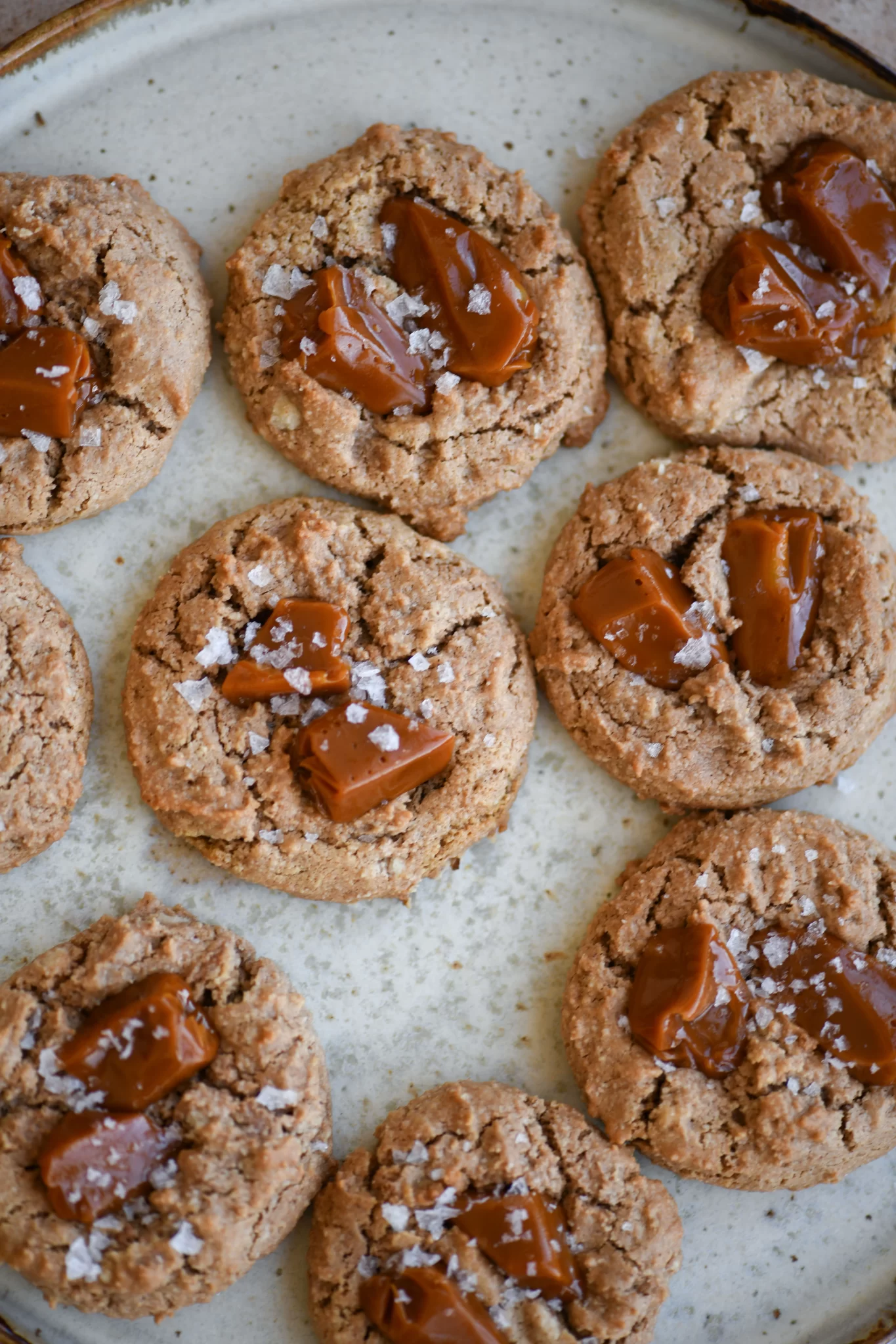 salted caramel almond cookies on plate close up