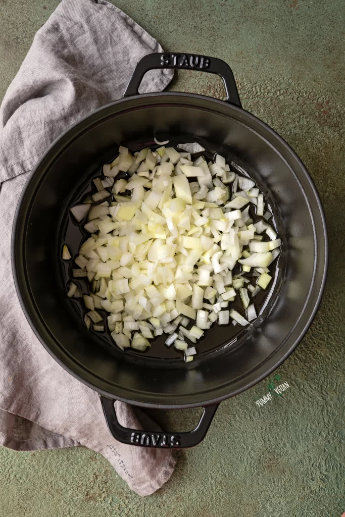sautéing onions in a pot