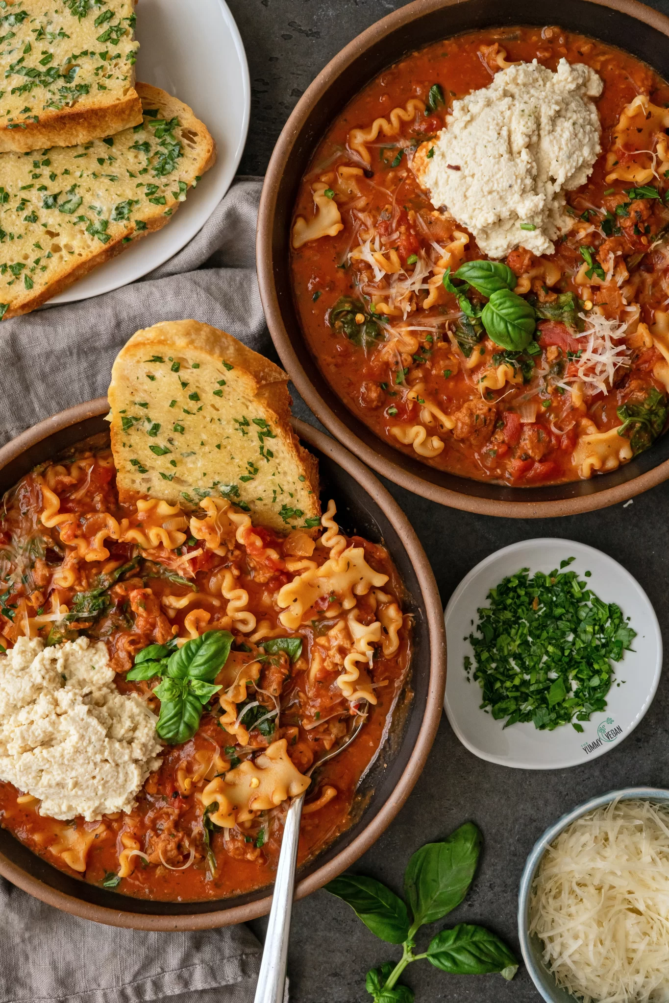 vegan lasagna soup served with garlic bread