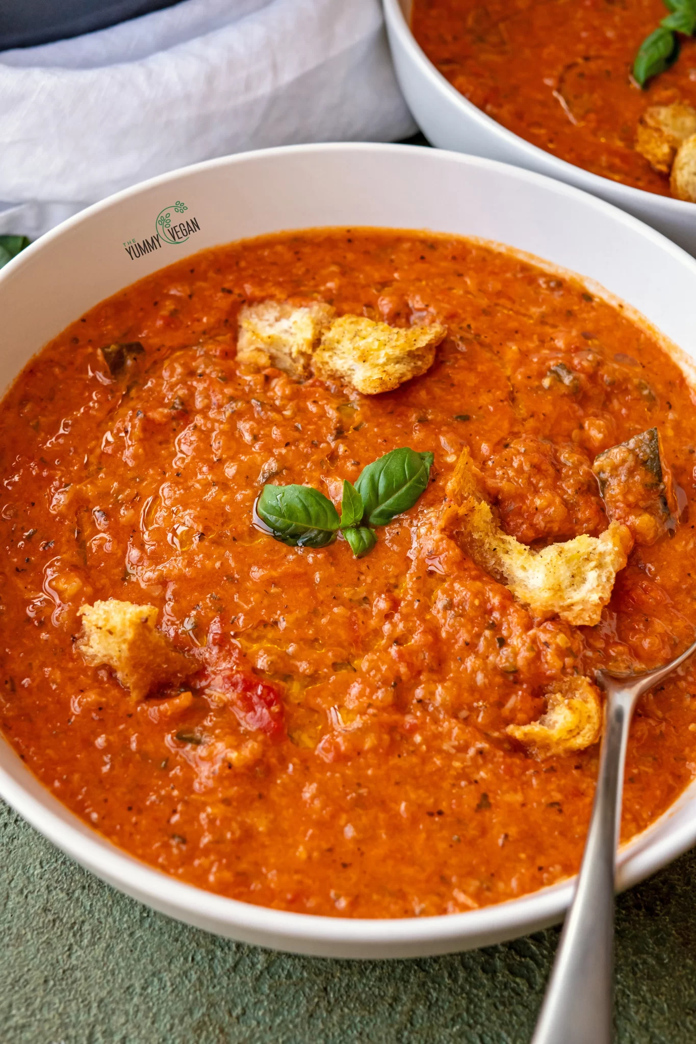 Creamy Tomato Zucchini Soup in bowl with spoon